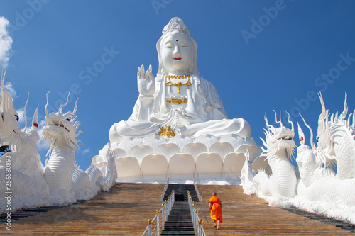 Chiang rai Wat Huay Pla Kang is a temple complex containing a big Buddha statue and 9 floor pagoda and a beautiful white temple. It’s about 5 miles North of Chiang Rai City,Thailand photo