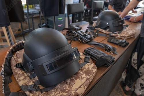 Full cover helmet as online game's item on the camouflage style bag 