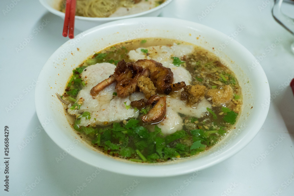 Egg noodle topping with red BBQ pork with soup