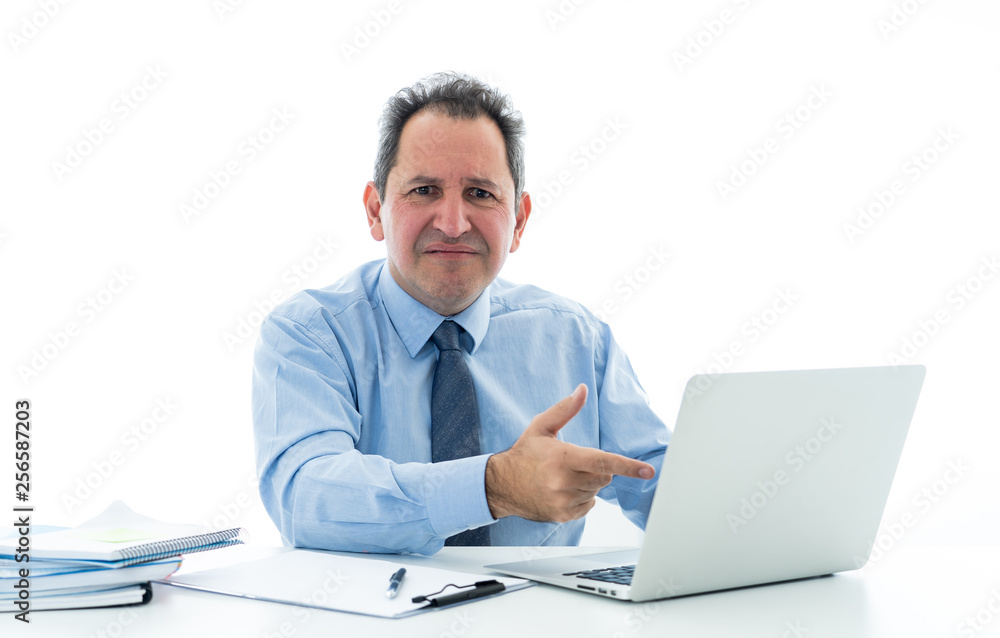 Overwhelmed and desperate mature businessman working with laptop feeling angry and furious at office Overwhelmed and desperate mature businessman working with laptop feeling angry and furious at office