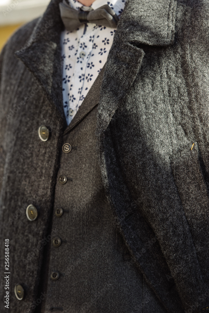 custom made wallpaper toronto digitalA man in a suit and sweater poses on the street. Advertising of men's clothing