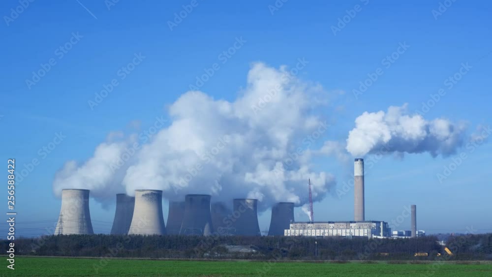 Smoke rising from a coal fired power station themes of energy pollution Smoke rising from a coal fired power station themes of energy pollution