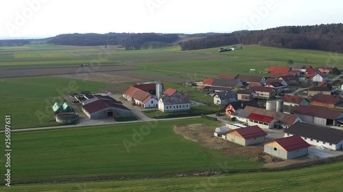 Livestock and dairy farms in a small village in Europe, Levanjci, county of Destrnik in Slovenia, aerial view of eastern Slovenia's rural countryside, agriculture and landscape concept photo