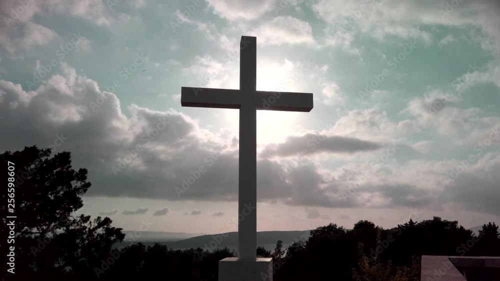 Cross with a clouds and sun in background, park Marjan, Split - Croatia Cross with a clouds and sun in background, park Marjan, Split - Croatia