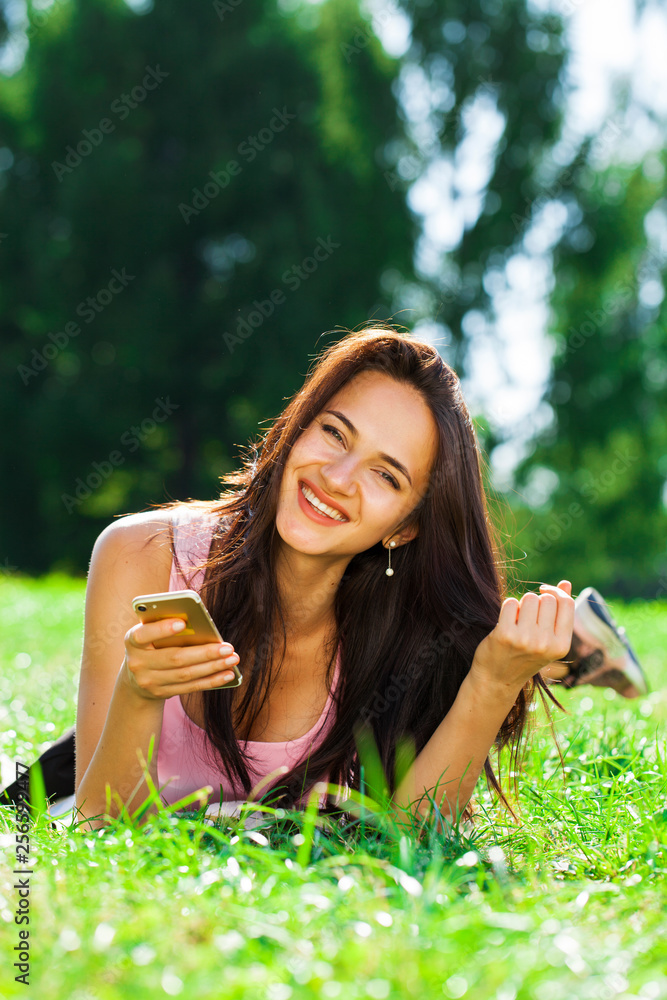 Happy beautiful brunette girl calling by phone Happy beautiful brunette girl calling by phone