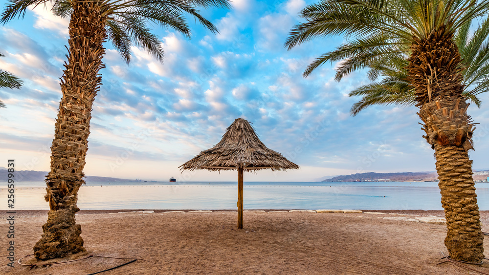 Morning at a public beach of Eilat - famous tourist resort and recreational city in Israel and Middle East