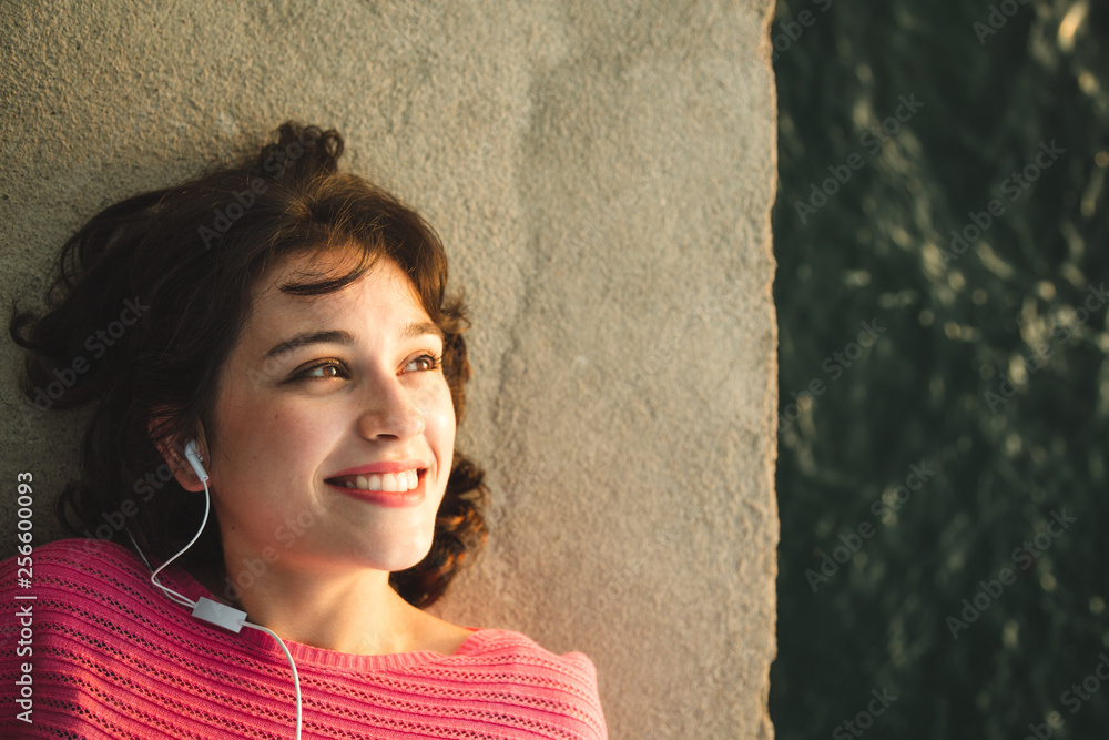 Girl enjoying music, sun and sea Girl enjoying music, sun and sea