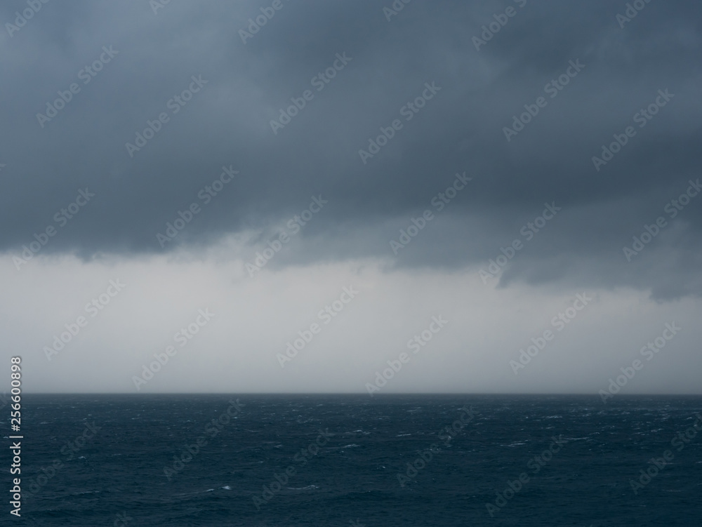 Rough weather on sea with stormy clouds