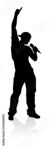 A singer pop  country music  rock star or hiphop rapper artist vocalist singing in silhouette