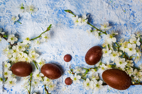 Spring blossom flowers and chocolate eggs
