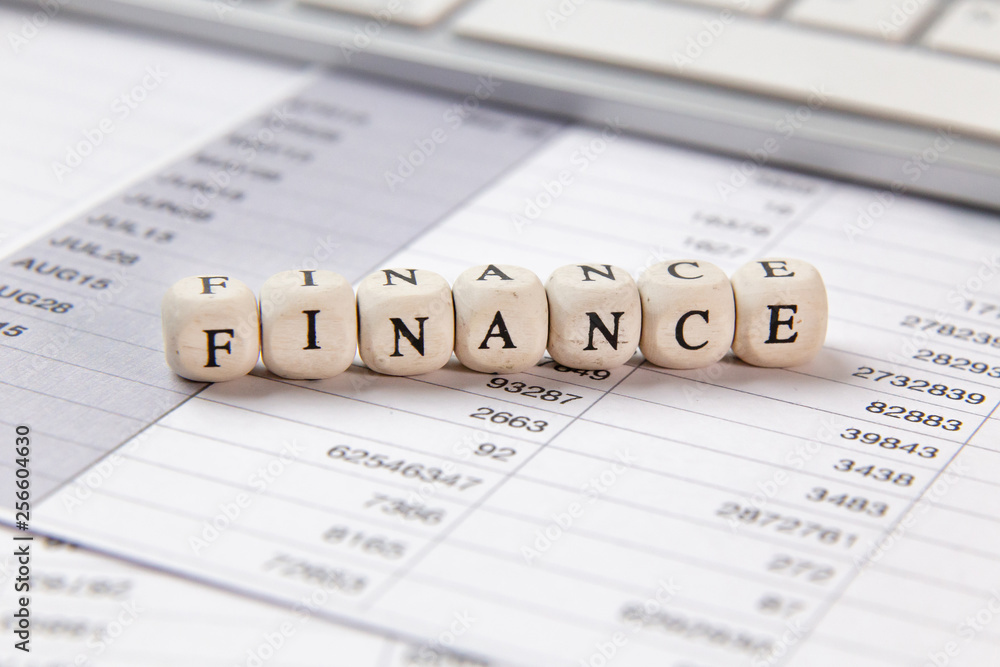 The finance word on wood cube business content image. The finance word on wood cube business content image.