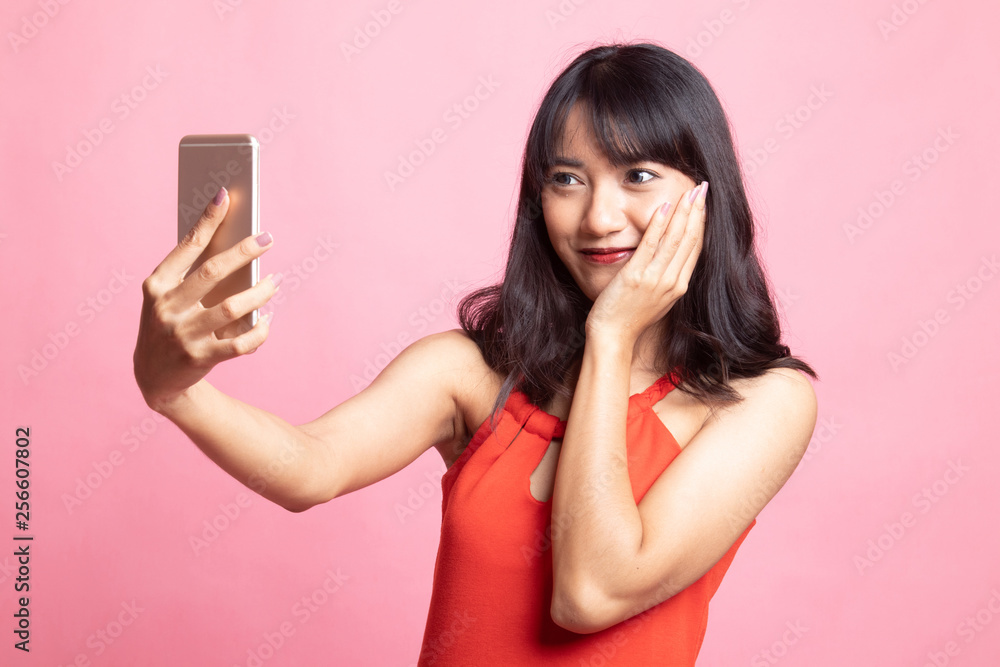 Young Asian woman selfie with mobile phone. Young Asian woman selfie with mobile phone.