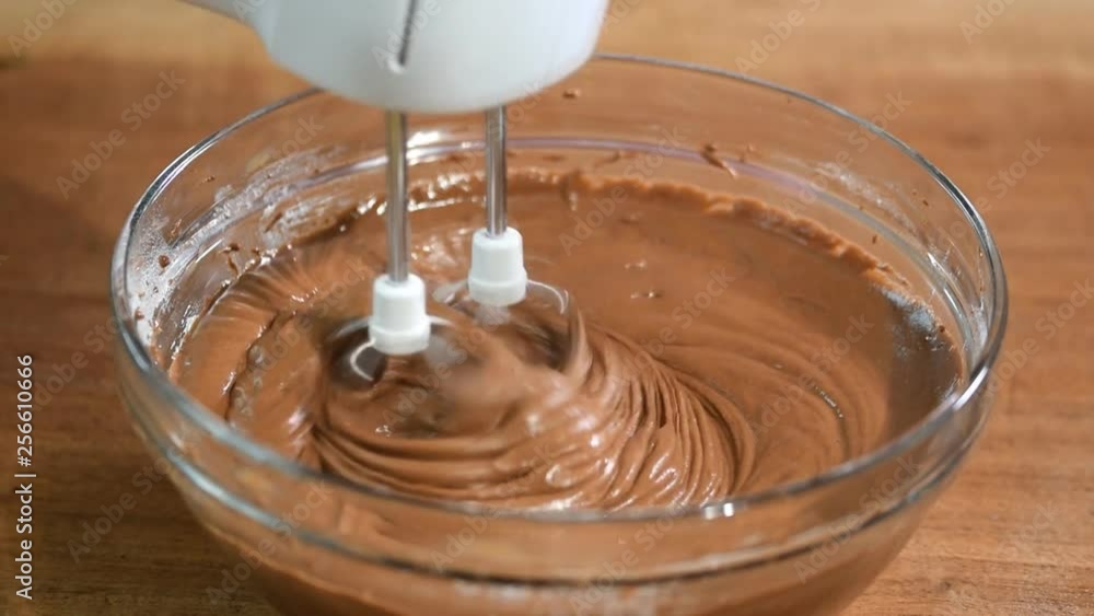 Mixing chocolate cake batter. Mixing chocolate cake batter.