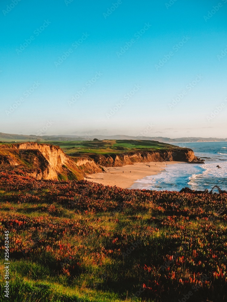 Beautiful view from the hill to the California coast with meadow and beach near San Francisco