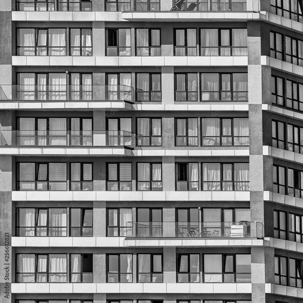 Detail of a monotonous ugly skyscraper in a suburban area, Black and white, bw Detail of a monotonous ugly skyscraper in a suburban area, Black and white, bw
