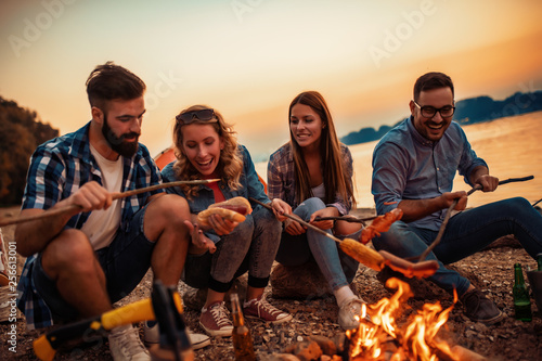 Friends camping on the beach photo