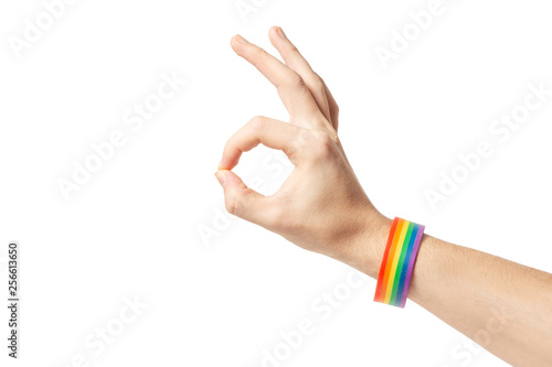 Isolated hand gesture with rainbow gay pride bracelet