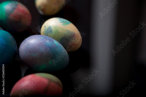 Group of easter painted eggs on black background