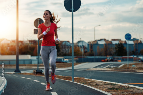 Fototapeta Naklejka Na Ścianę i Meble -  Young  woman jogging outdoors