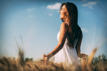 Young beautiful woman spending time in nature