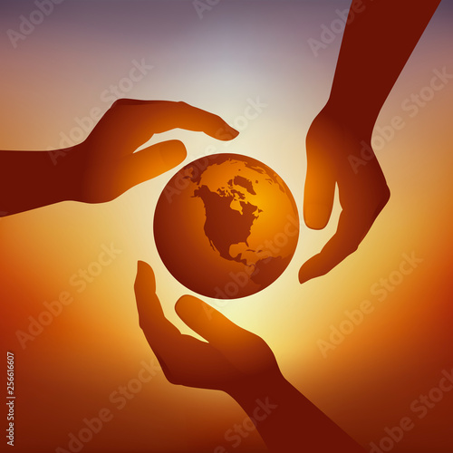 Concept de la protection de l’environnement avec trois mains qui protègent symboliquement la terre contre le danger du réchauffement climatique