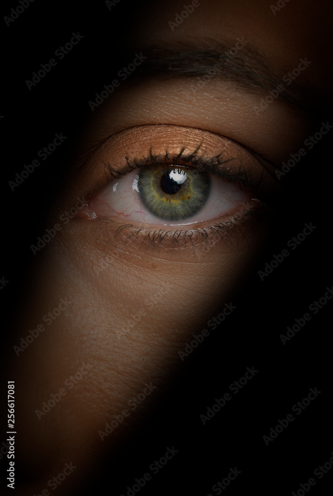 person spying  eye close-up