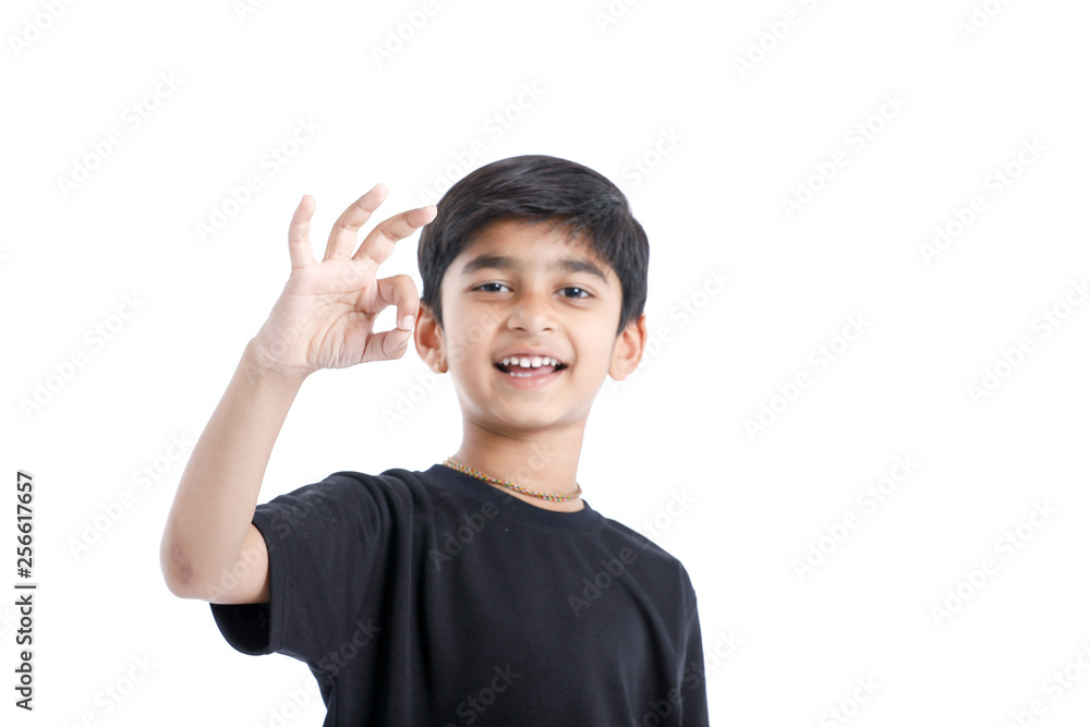 Indian child showing nice gesture with hand Indian child showing nice gesture with hand