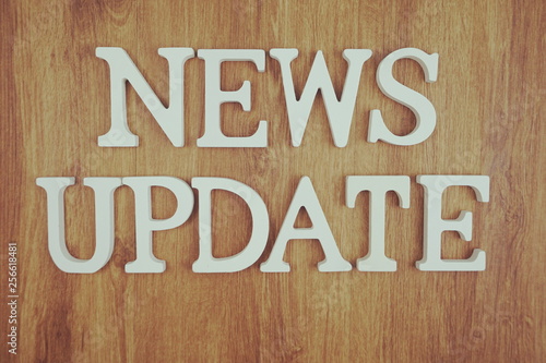 News Update alphabet letter with space copy on wooden background © may1985