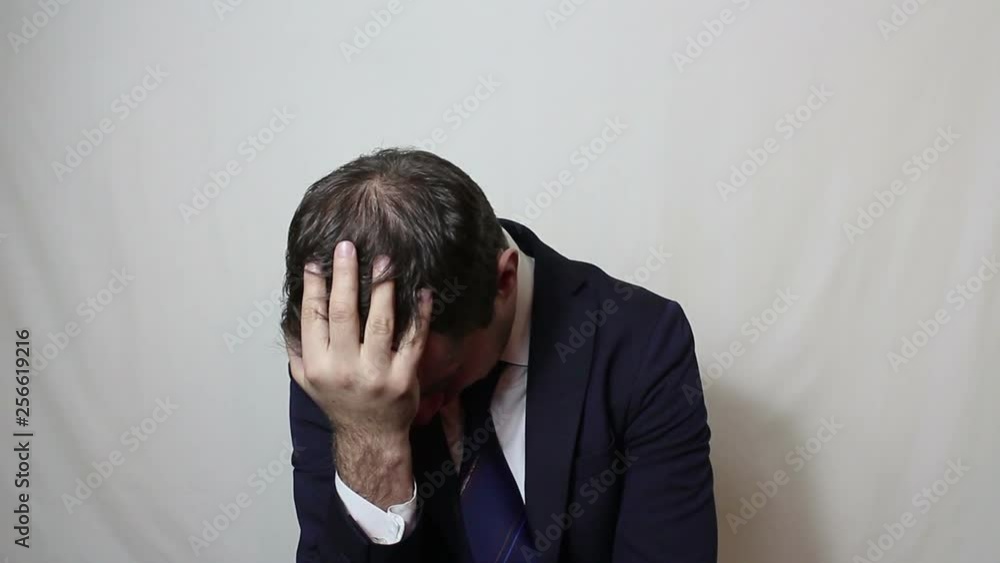 Young handsome businessman in despair beats hand on the forehead.Portrait on white background. Young handsome businessman in despair beats hand on the forehead.Portrait on white background.