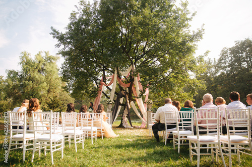 Big tree decorated for wedding ceremony outside