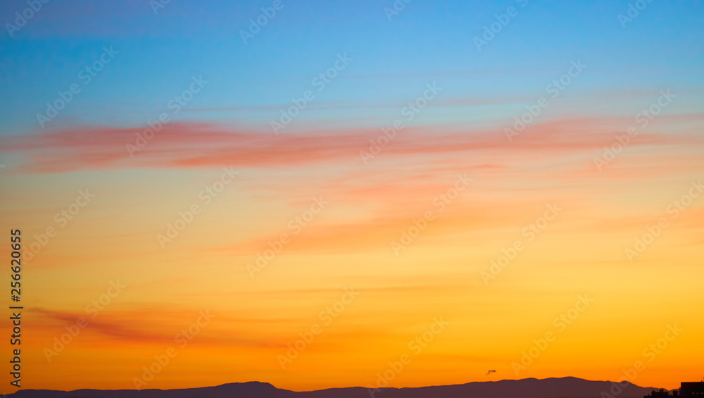 Colorful and dramatic sunset. Vivid abstract natural background.