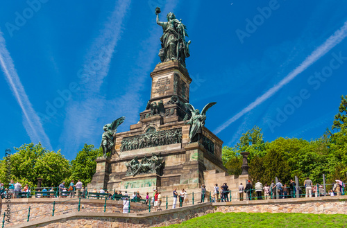 Lovely view of the monument Niederwalddenkmal on a nice sunny day with a blue sky. The Germania sculpture on top is a famous tourist attraction and was built to commemorate the Unification of Germany.