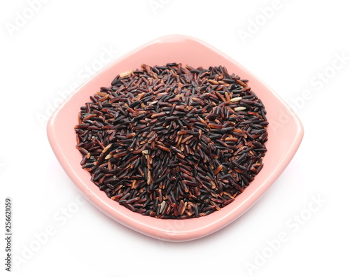 Wild black rice in bowl isolated on white background