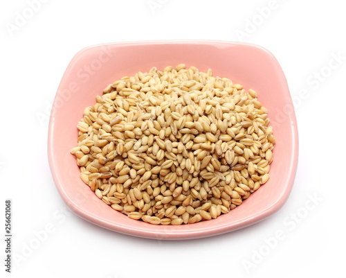 Wheat grains in bowl isolated on white background