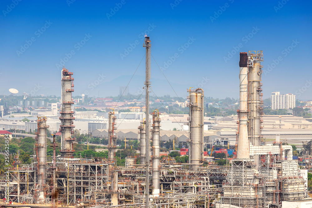 Oil refinery industry for distillate crude oil to gasoline for energy business and transportation,  and industrial zone in background