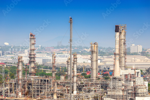 Oil refinery industry for distillate crude oil to gasoline for energy business and transportation, and industrial zone in background
