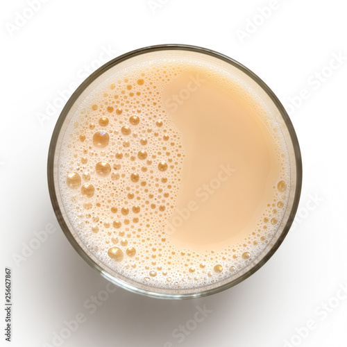 Glass of vegan milk isolated on white from above.