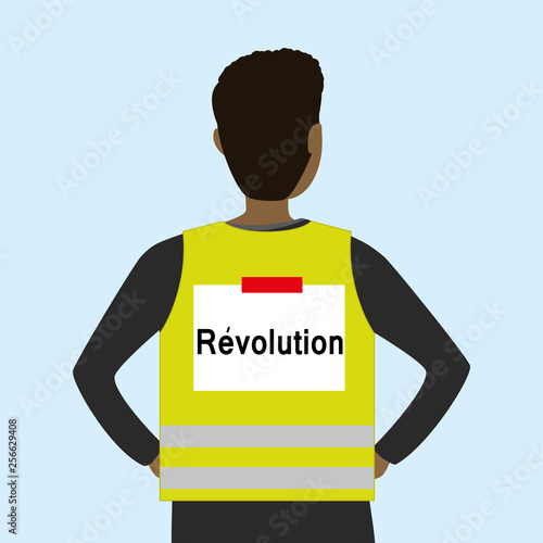 Man wearing a yellow vest, back view,text on back- revolution,