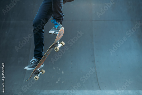 Skateboarding hobby. Man active life. Guy on skateboard performing ollie trick on ramp. Copy space.