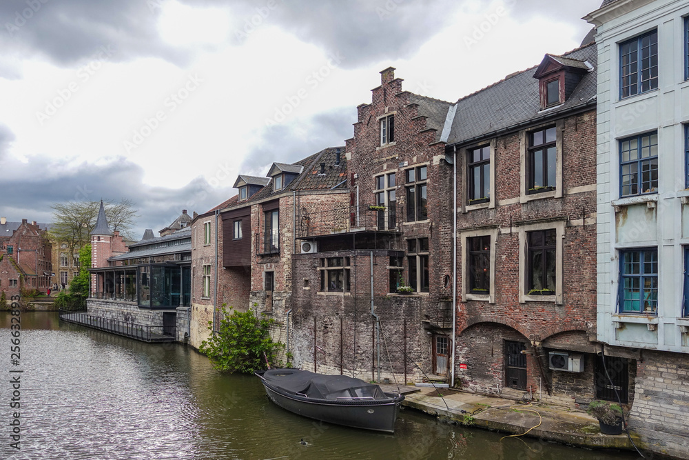 Old classic buildings along the river in Belgium