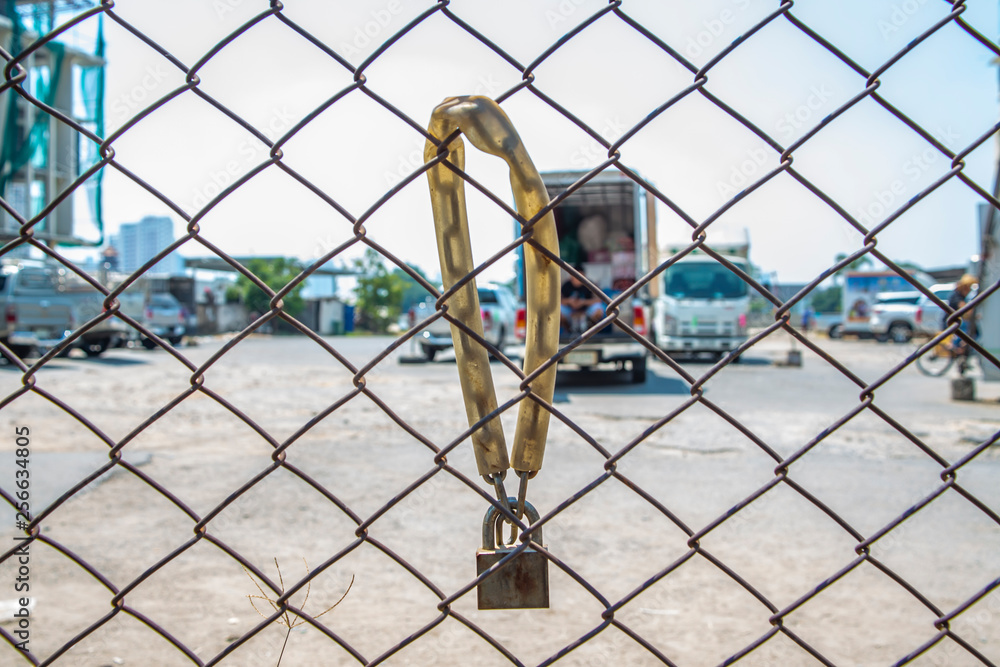 Rusty metal gate locked with Padlock, Outdoor Rusty metal gate locked with Padlock, Outdoor