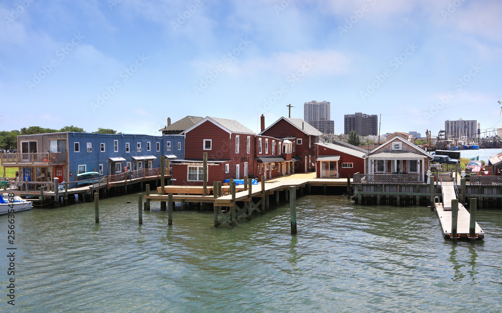 ATLANTIC CITY NEW JERSEY - JULY 4: Ocean view of colorful seashore homes on July 4, 2018 in Atlantic City New Jersey. ATLANTIC CITY NEW JERSEY - JULY 4: Ocean view of colorful seashore homes on July 4, 2018 in Atlantic City New Jersey.