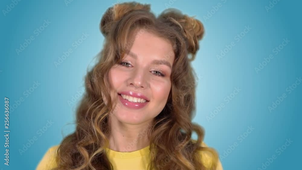 Portrait of a beautiful enthusiastic girl in a good mood smiling looking at the camera Portrait of a beautiful enthusiastic girl in a good mood smiling looking at the camera