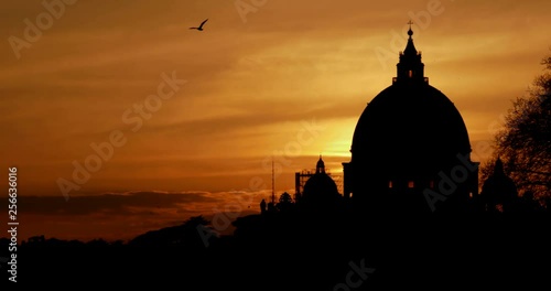 Time Lapse Roma Dramatic Sunset behind the silhouette of the dome of St. Peter