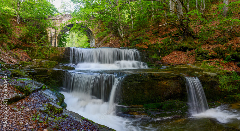 Waterfall under stone bridge in Rhodope mountain near Sitovo village, Bulgaria, Europe, spring photography Waterfall under stone bridge in Rhodope mountain near Sitovo village, Bulgaria, Europe, spring photography