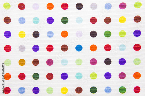 Colorful dots on white fabric