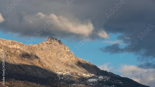 Aiguilles de Chabrieres (Chabrieres Needles) and passing clouds in Winter. Time-lapse. Ecrins national Park, Hautes-Alpes, European Alps, France photo