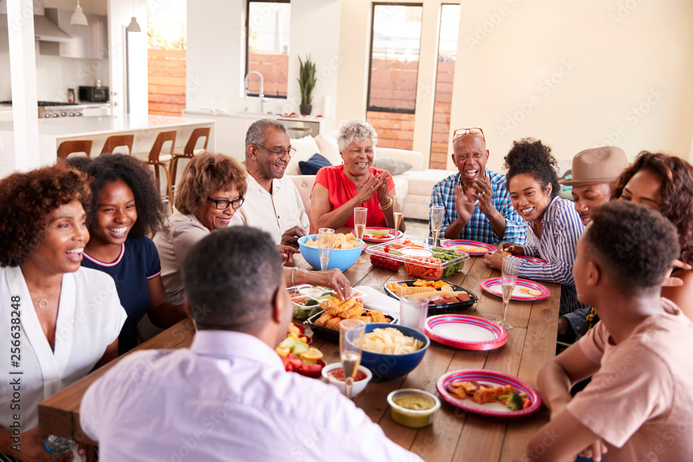 Three generation black family celebrating grandmother's birthday together,close up Three generation black family celebrating grandmother's birthday together,close up