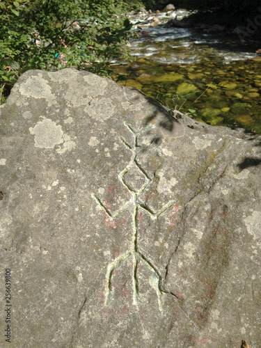 Rock paintings of ancient people. Ancient drawing on a rock in Siberia