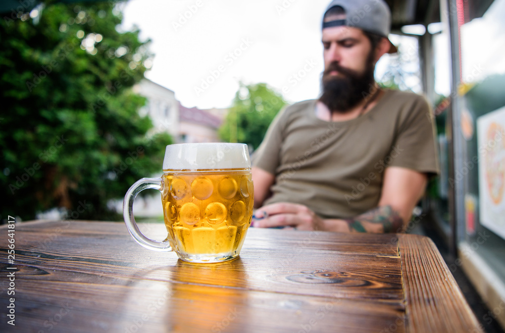 Refreshing with crisp finish. Chilled beer mug on cafe table. Brutal man relaxing with alcoholic drink in beer restaurant. Bearded man drinking beer in bar. Hipster enjoying beer in pub Refreshing with crisp finish. Chilled beer mug on cafe table. Brutal man relaxing with alcoholic drink in beer restaurant. Bearded man drinking beer in bar. Hipster enjoying beer in pub